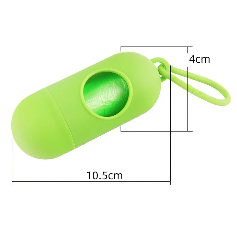 A black rectangular dog poop bag holder with a side metal hook and a grey Velcro strap, showing its compact size.