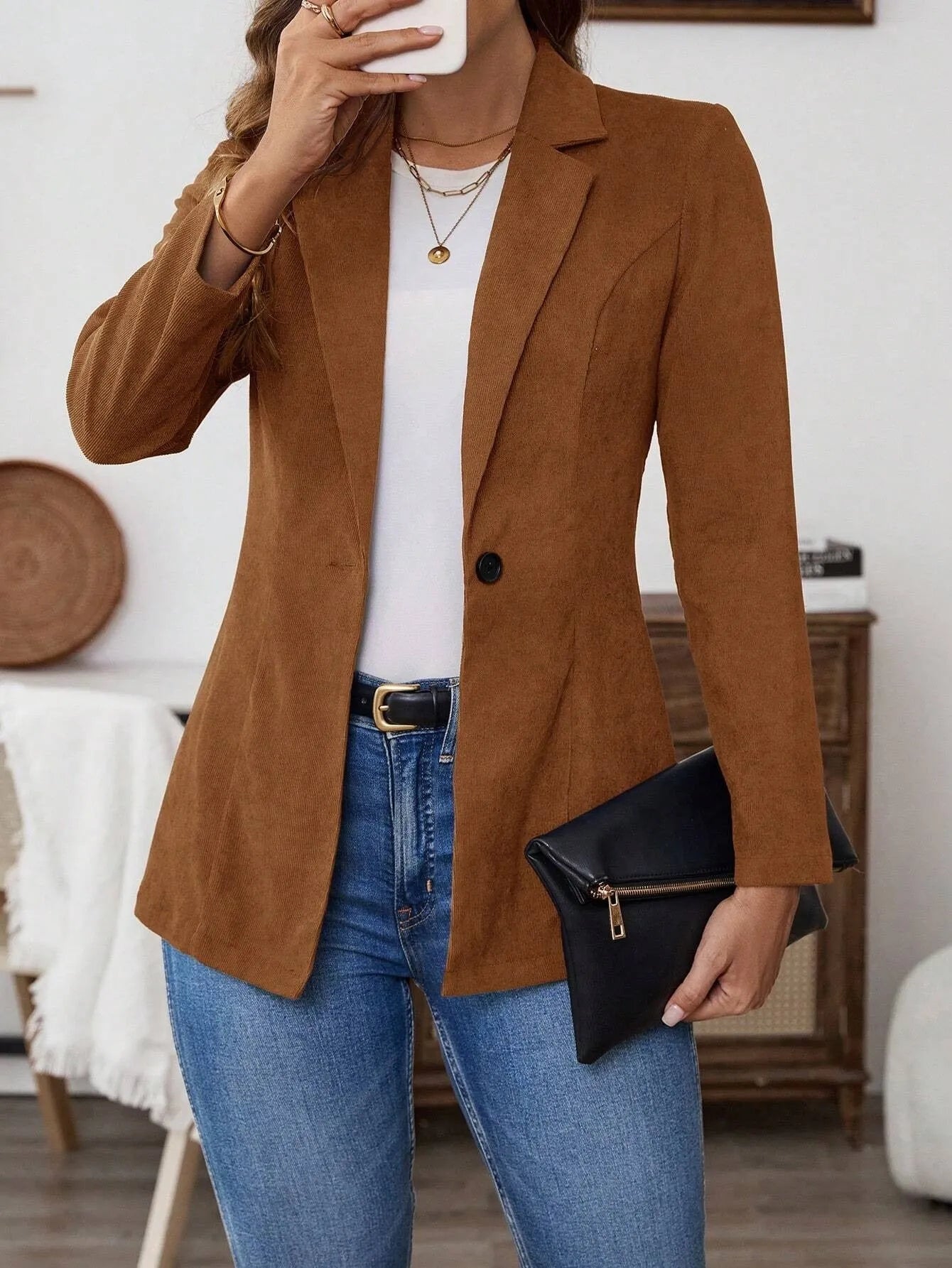 Brown men's single-breasted lapel leisure suit coat on a hanger.