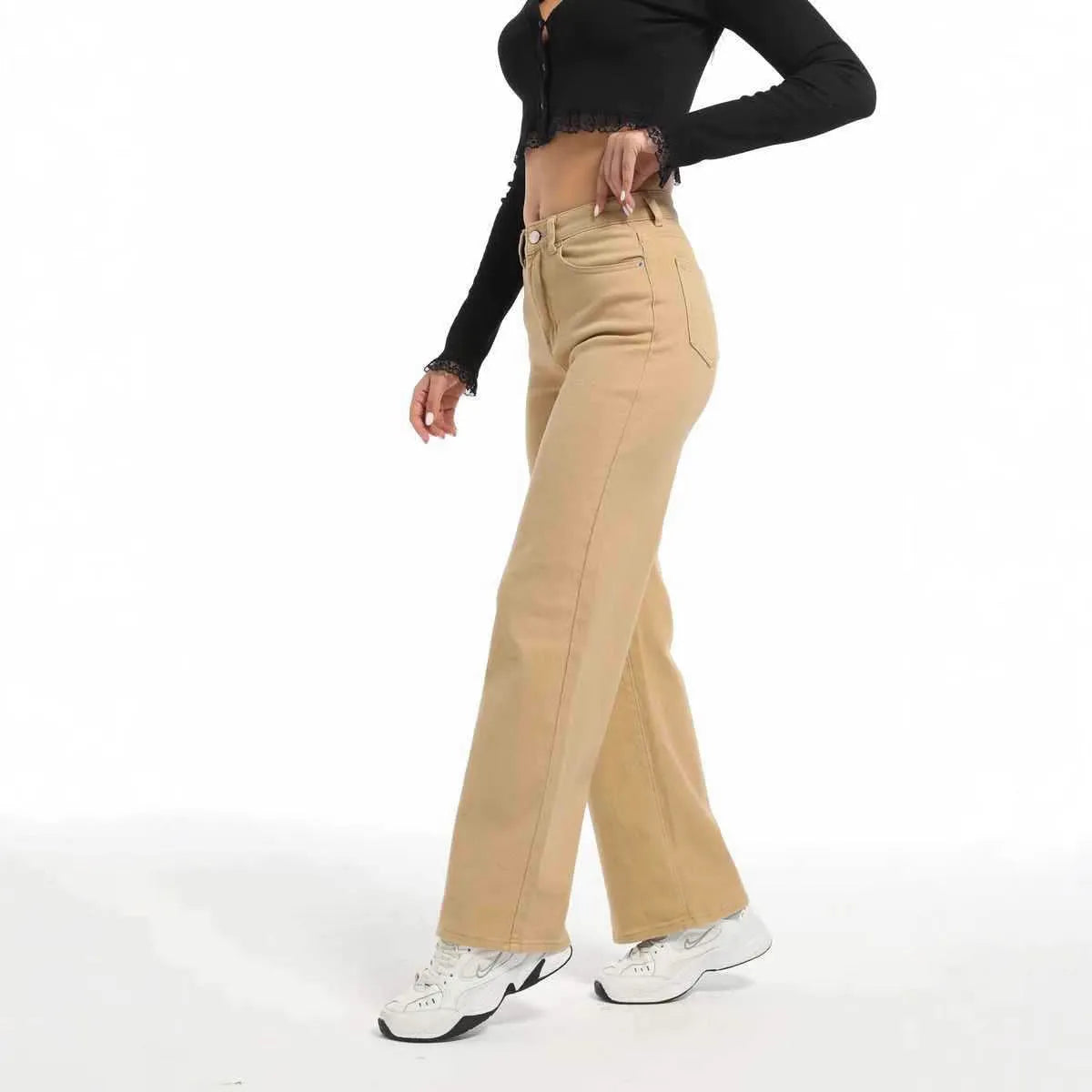Women's high-waisted straight leg jeans in apricot colour, showing wide leg and elastic cotton fabric.