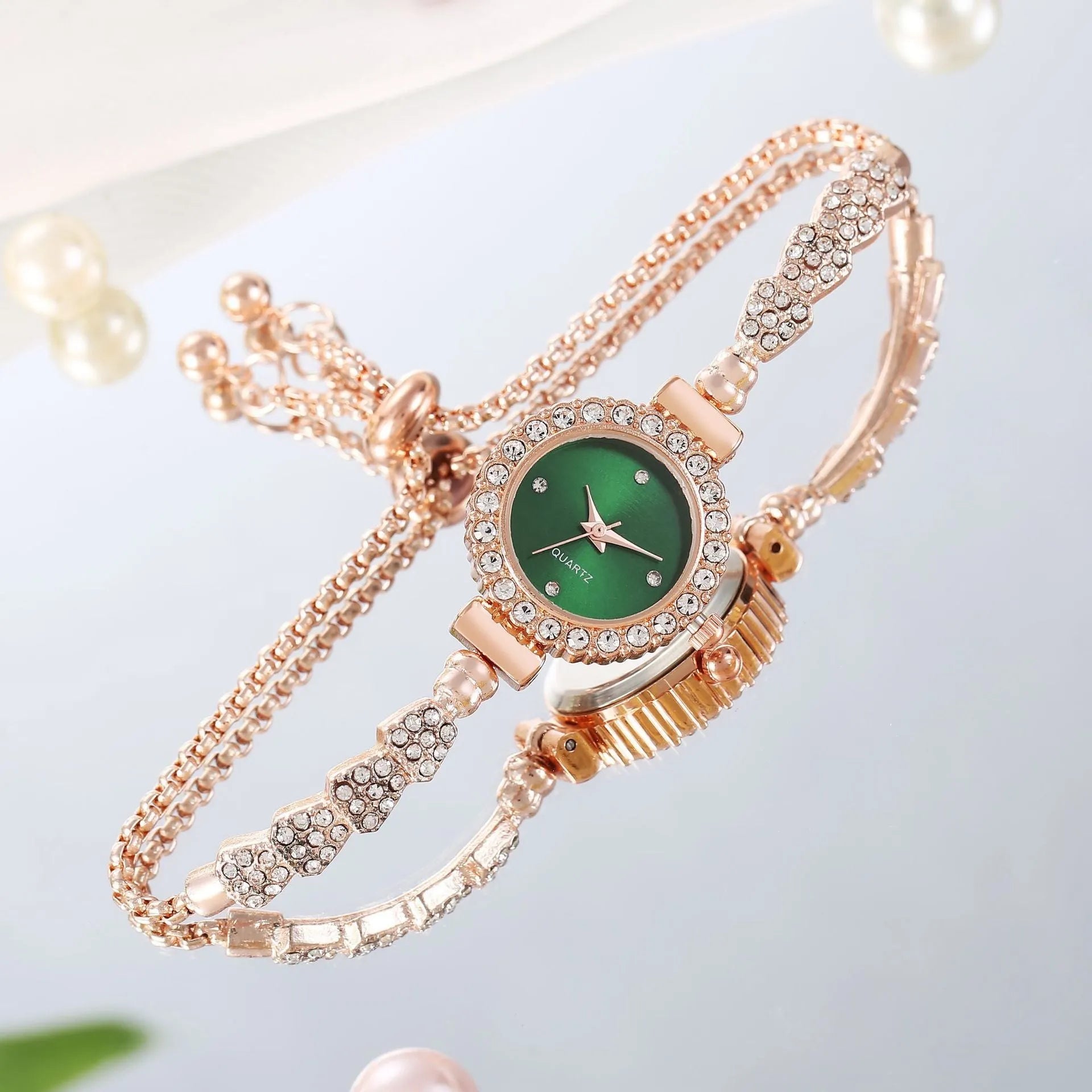 Gold fine strap women's watch with round dial and stainless steel jewellery buckle