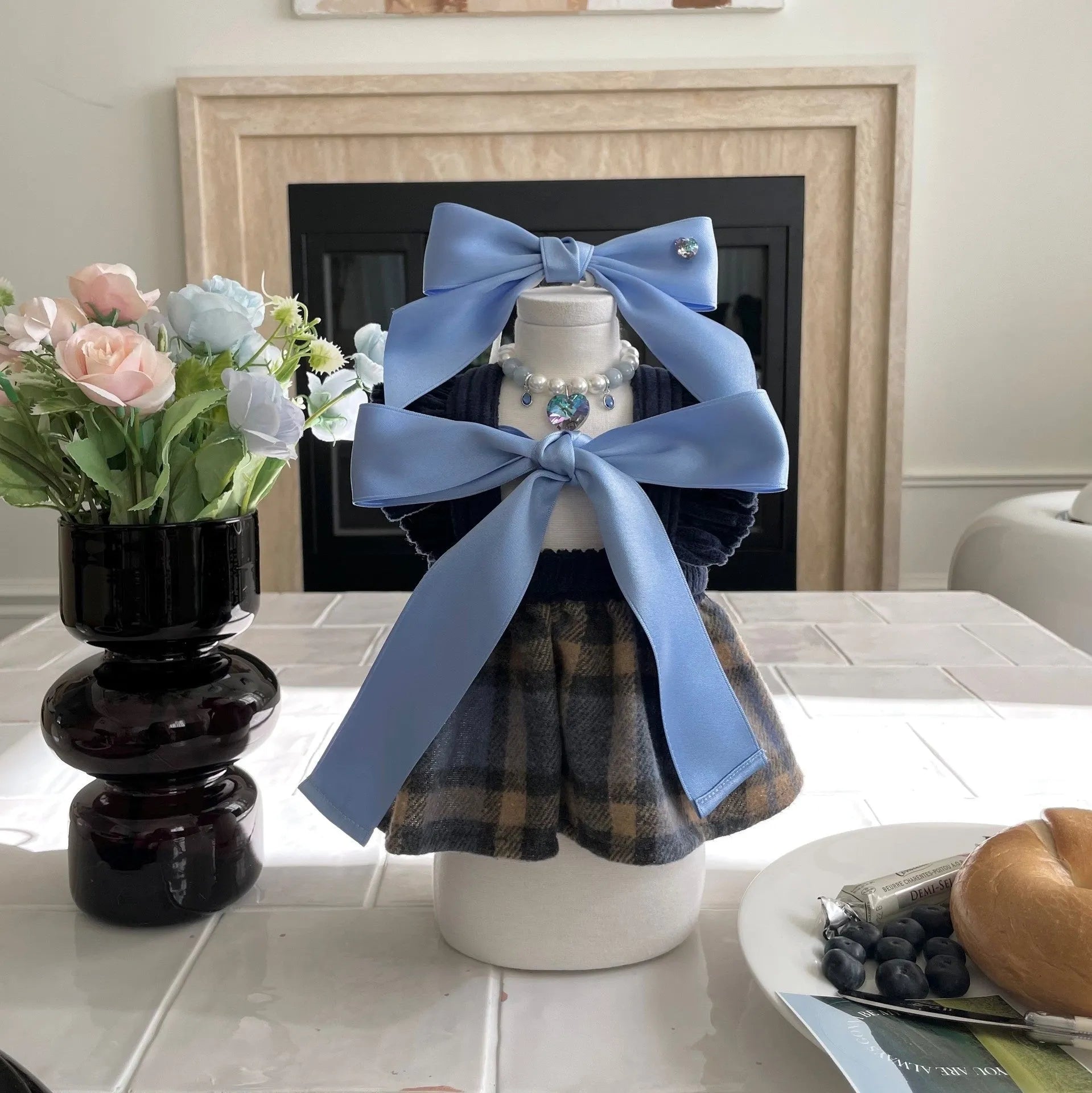 Blue adjustable dog hair band headband with a princess-style bow on a small dog.