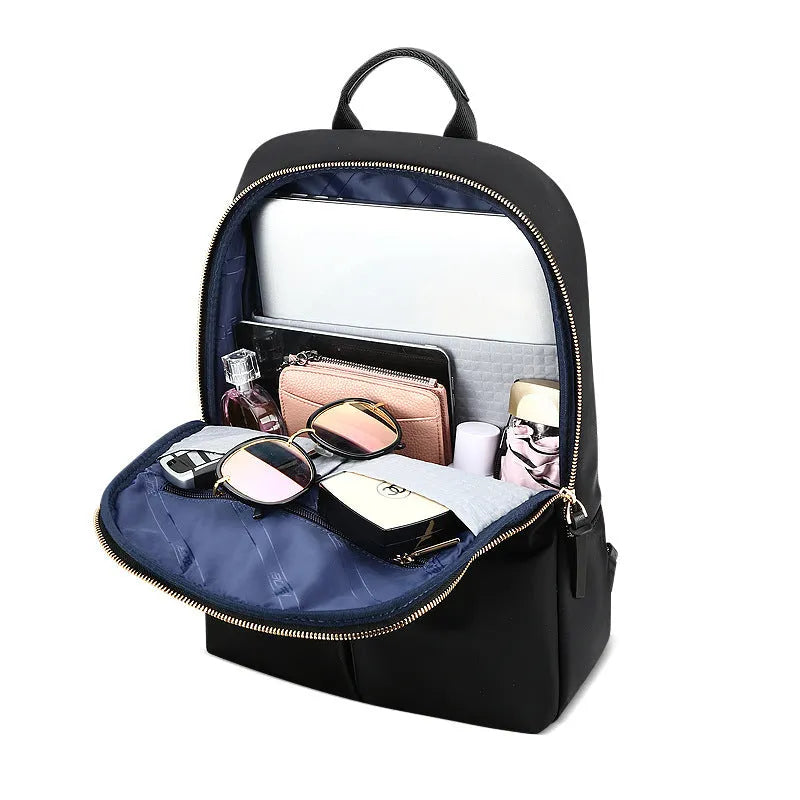 Women's nylon backpack computer bag under 20L with zip closure, laptop insert, phone pocket and certificate bag in Black or Pink