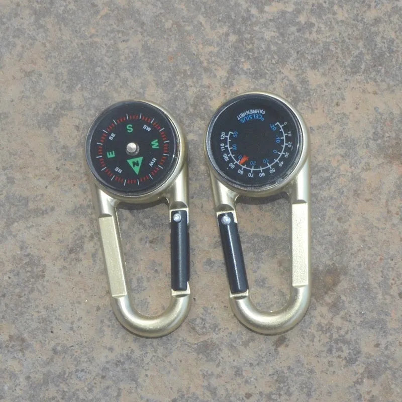 Black zinc alloy double-sided carabiner with a climbing button closure, showing integrated compass and thermometer.