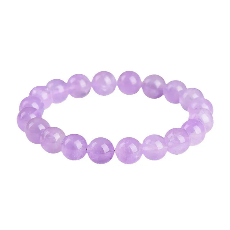 Lavender amethyst crystal bracelet with round beads showing light purple colour and water ripple design.