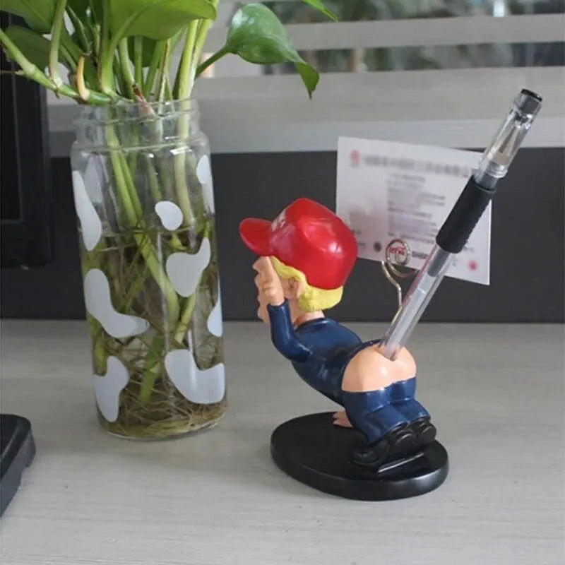 Blue synthetic resin pen holder with shaking head doll design and business card holder section on a desk.