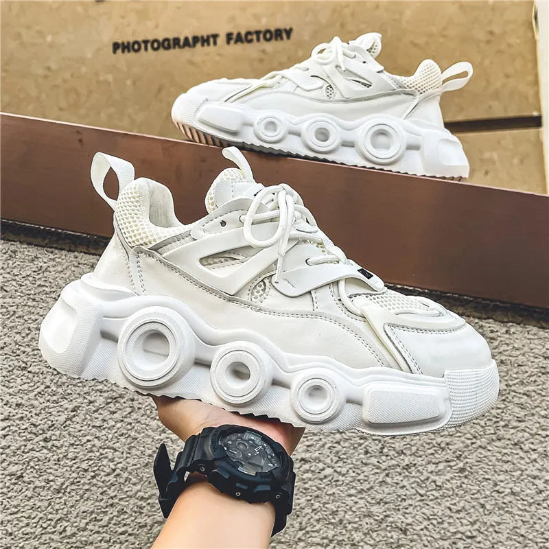Men's low-top sneaker in grey with breathable mesh upper, thick rubber sole, round toe, and lace-up front.