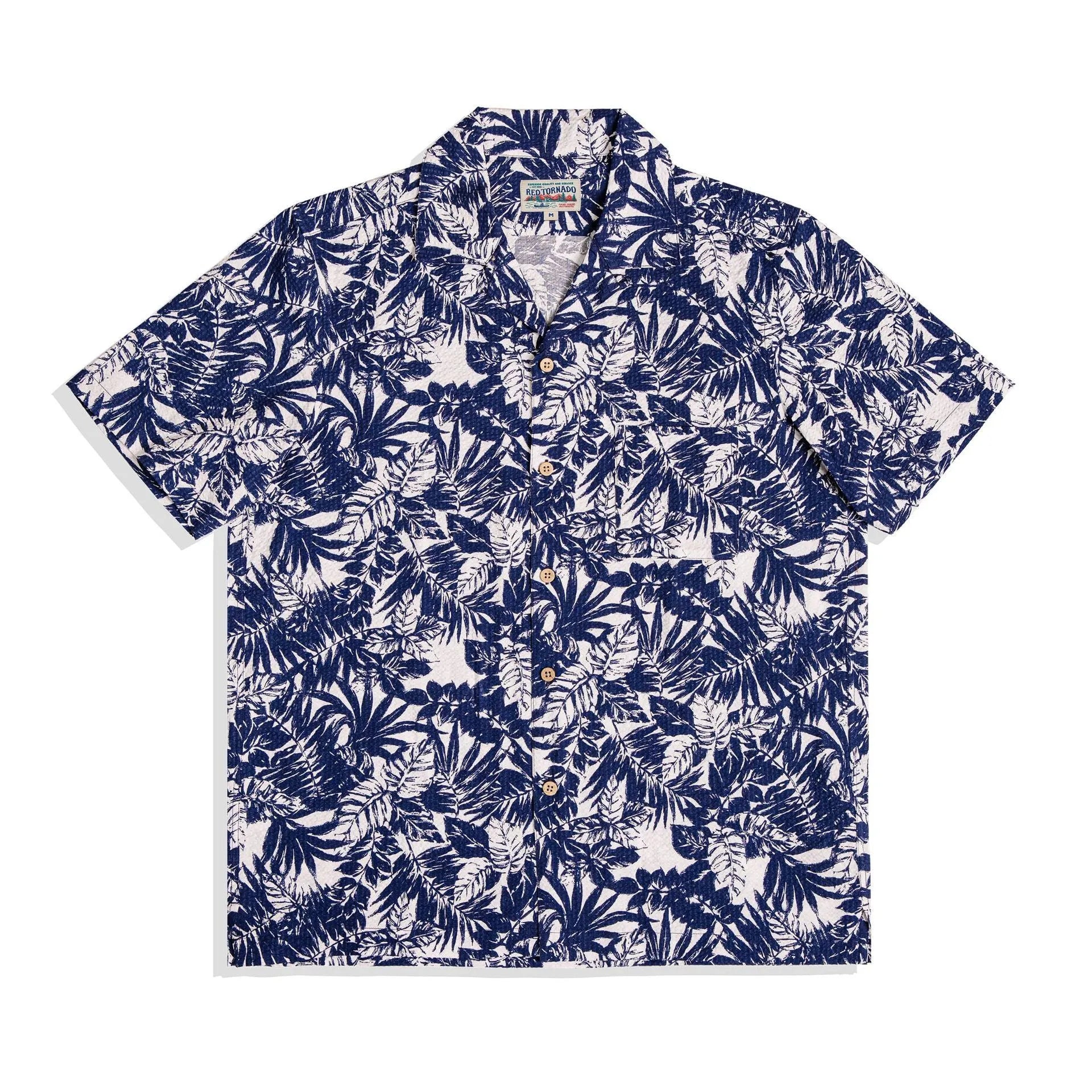 Man wearing a vintage floral print seersucker shirt with a Cuban collar in a loose, casual fit.