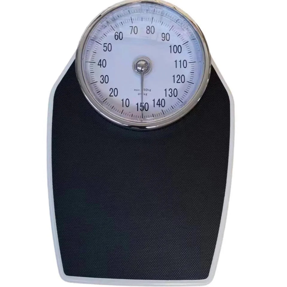 Black mechanical pointer bathroom scale on floor showing large dial and 47x35cm platform.