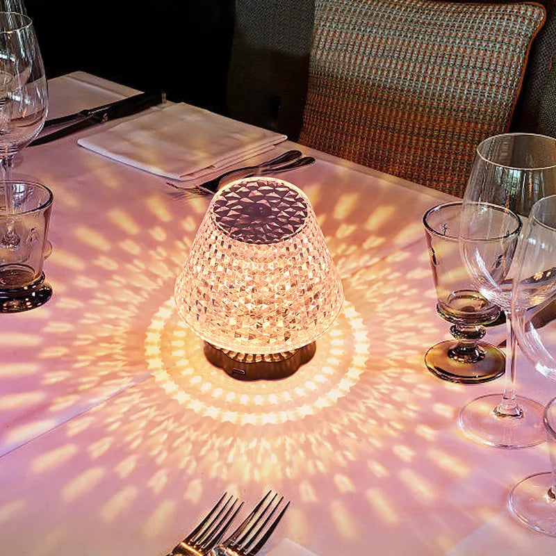 Crystal decorative table lamp with touch base on a nightstand, showing colour changing LED light.