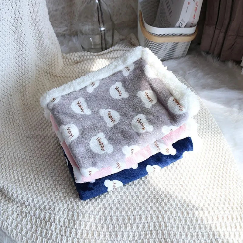 Thick lamb fleece pet dog blanket soft flannel cat cushion in blue on a wooden floor