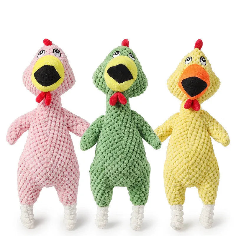 Soft pineapple fleece squeaker dog toy in yellow, green, and pink on a plain background