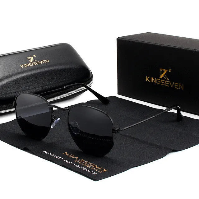 Men's classic round retro sunglasses in black frame on a grey background.