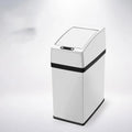 Black intelligent induction trash can with 3-litre capacity for car use on a car floor mat