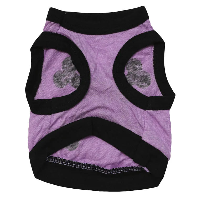 Set of five blue, orange, and purple cotton dog vests with Halloween skull bones pattern.