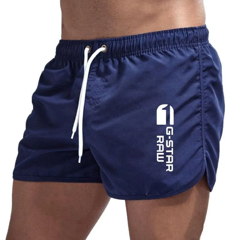 Man wearing thin polyester sports shorts with an elastic waistband in a bright colour like fluorescent green.
