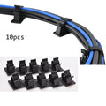 Black nylon adhesive cable clamps showing two-stage lock design for 13mm maximum cable diameter