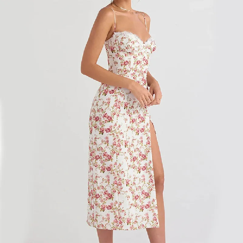 Women's blue lace flower print long suspender dress with a high leg slit on a model.