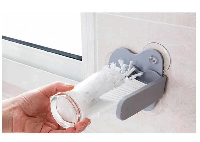 Grey rotating cup brush with suction cups for wall mounting and double cleaning heads