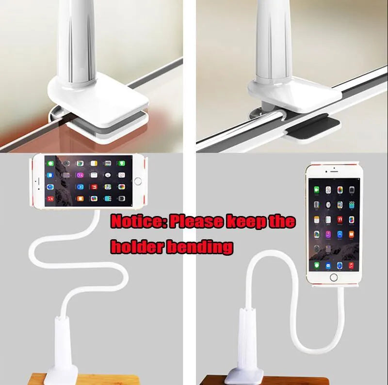 Black bedside oversize flat panel handset holder with a long arm on a wooden table.