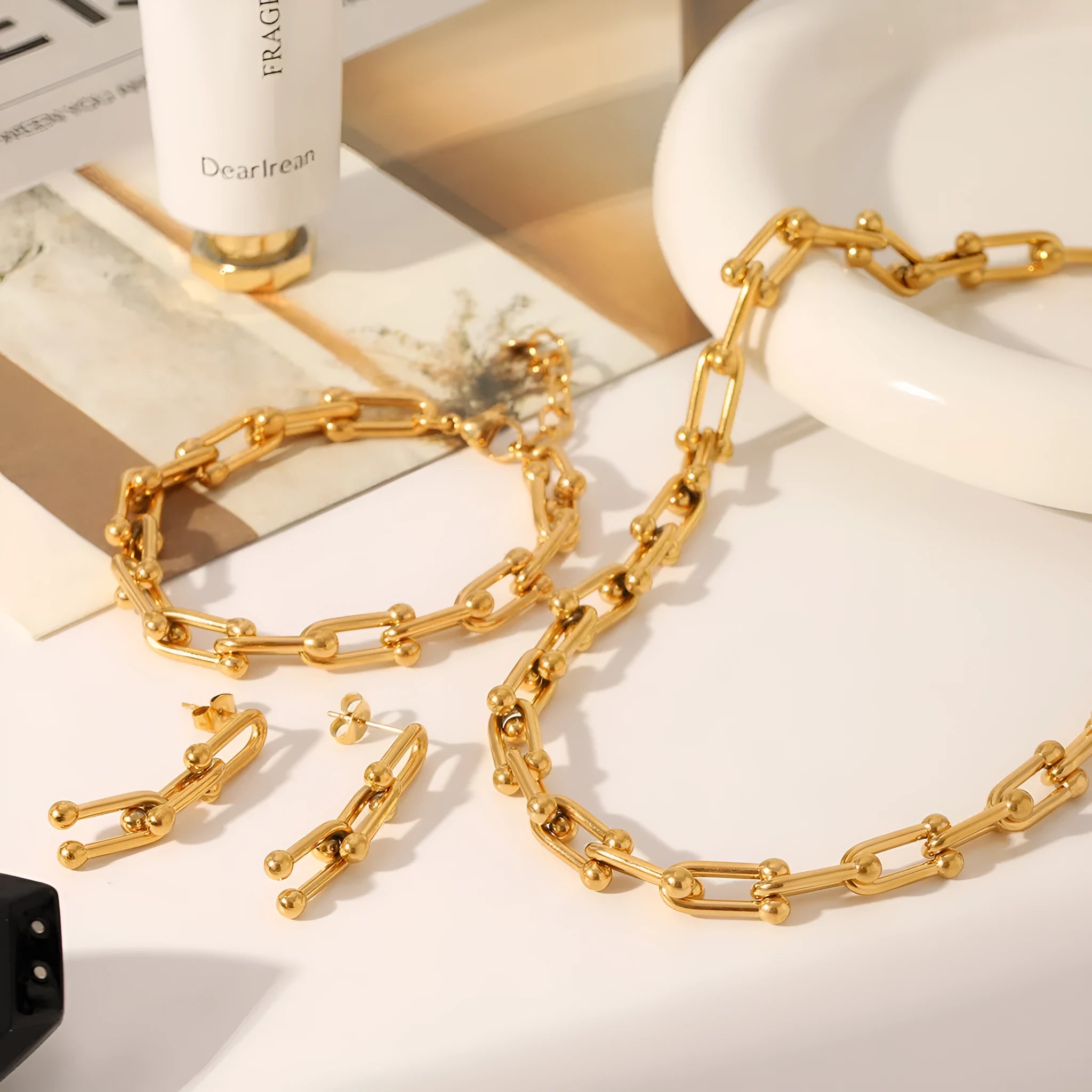 Matching stainless steel necklace, bracelet, and earrings set with a titanium steel horseshoe charm.