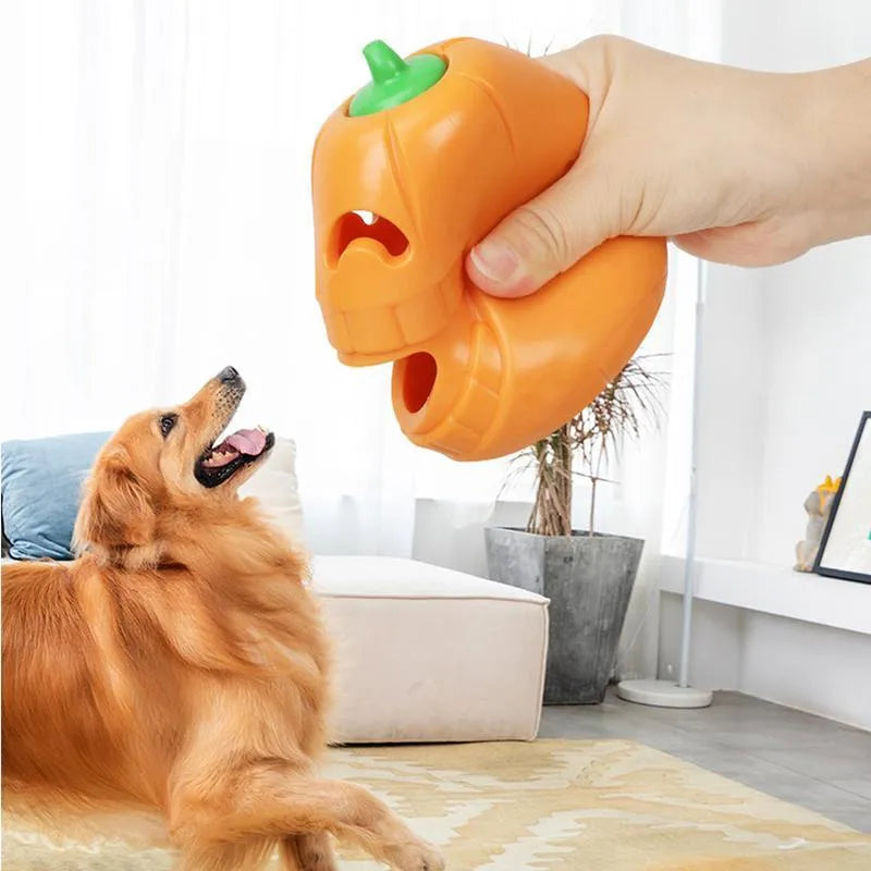 Yellow pumpkin-shaped dog chew toy made from TPR material measuring 8.6x11.5cm