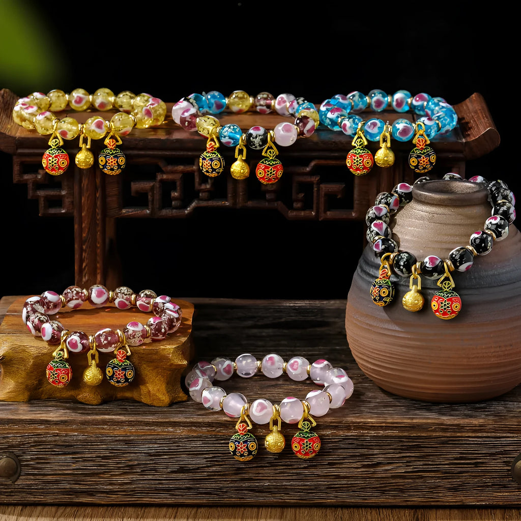 Handmade glass bracelet with swallowing gold beast design and heart shape in various colours