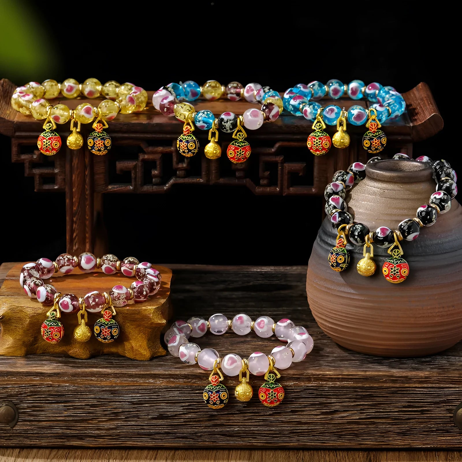Handmade glass bracelet with swallowing gold beast design and heart shape in various colours