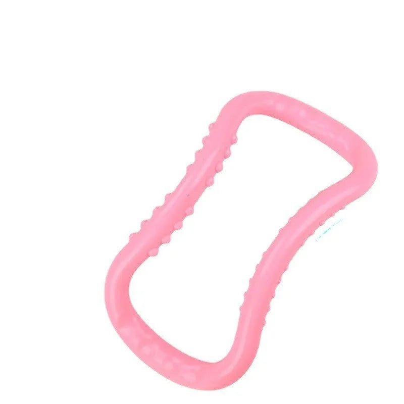 A purple PP plastic yoga ring or Pilates stretching roller on a plain background.