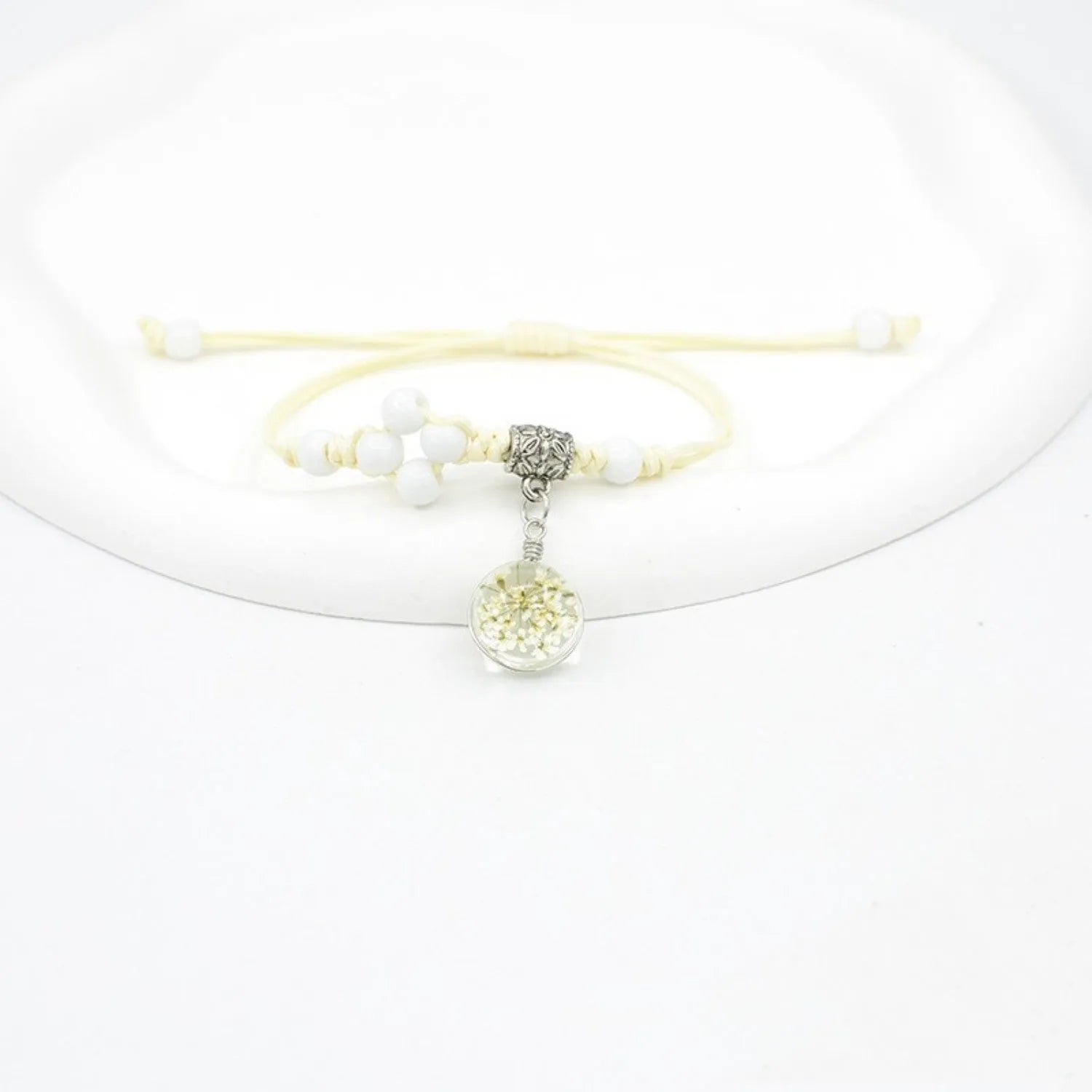 Glass dried flower bracelet with real preserved flowers in colourful beads, hand-woven construction