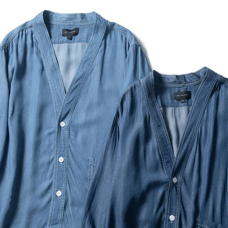 Men's dark blue three-quarter sleeve V-neck casual denim coat laid flat.