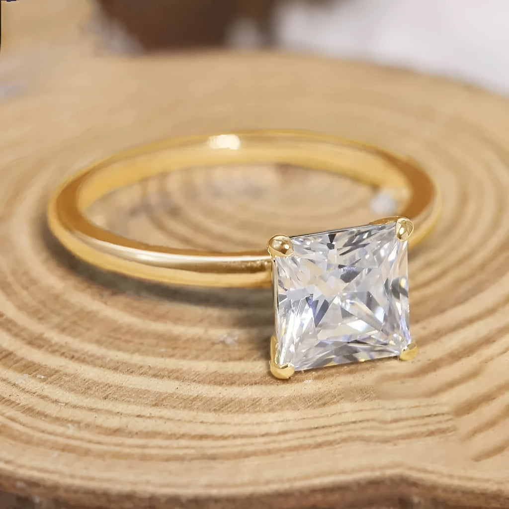 A simple geometric women's ring in 925 silver, shown in silver, gold, and rose gold colour options on a size chart.