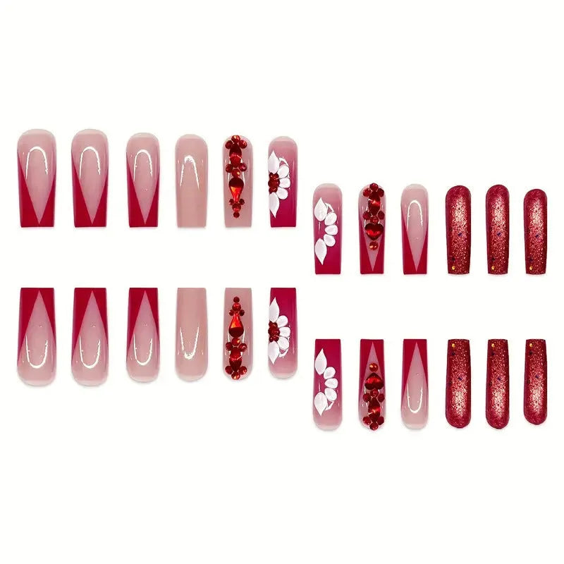 Set of sweet flower pattern press-on artificial nails with prismatic red diamonds in a long European square style.