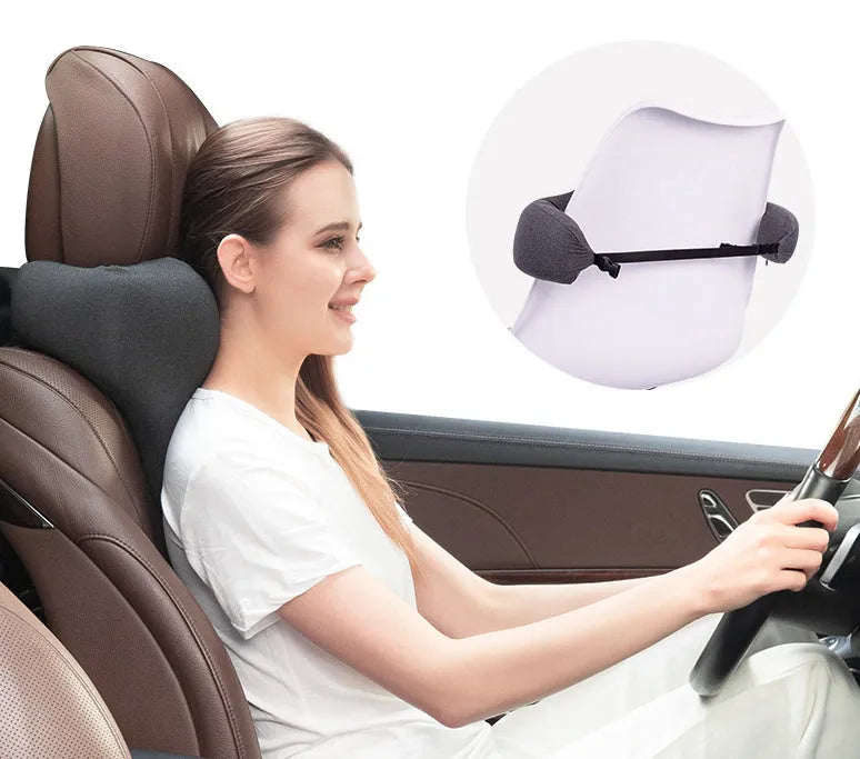 Solid-colour memory foam car neck pillow on a car headrest in dark grey, grey, or fog blue