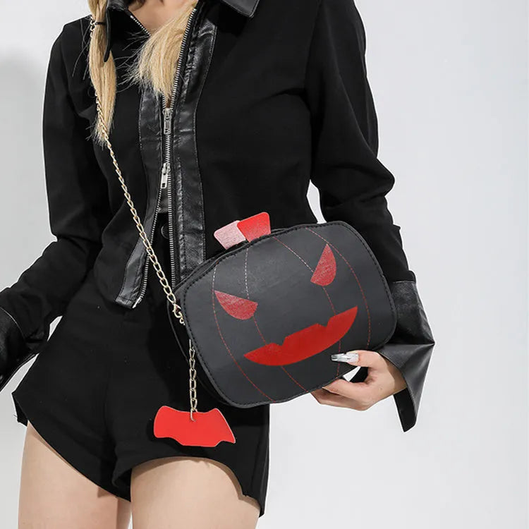 Halloween cartoon pumpkin shoulder bag for girls in colour options with chain crossbody strap on white background
