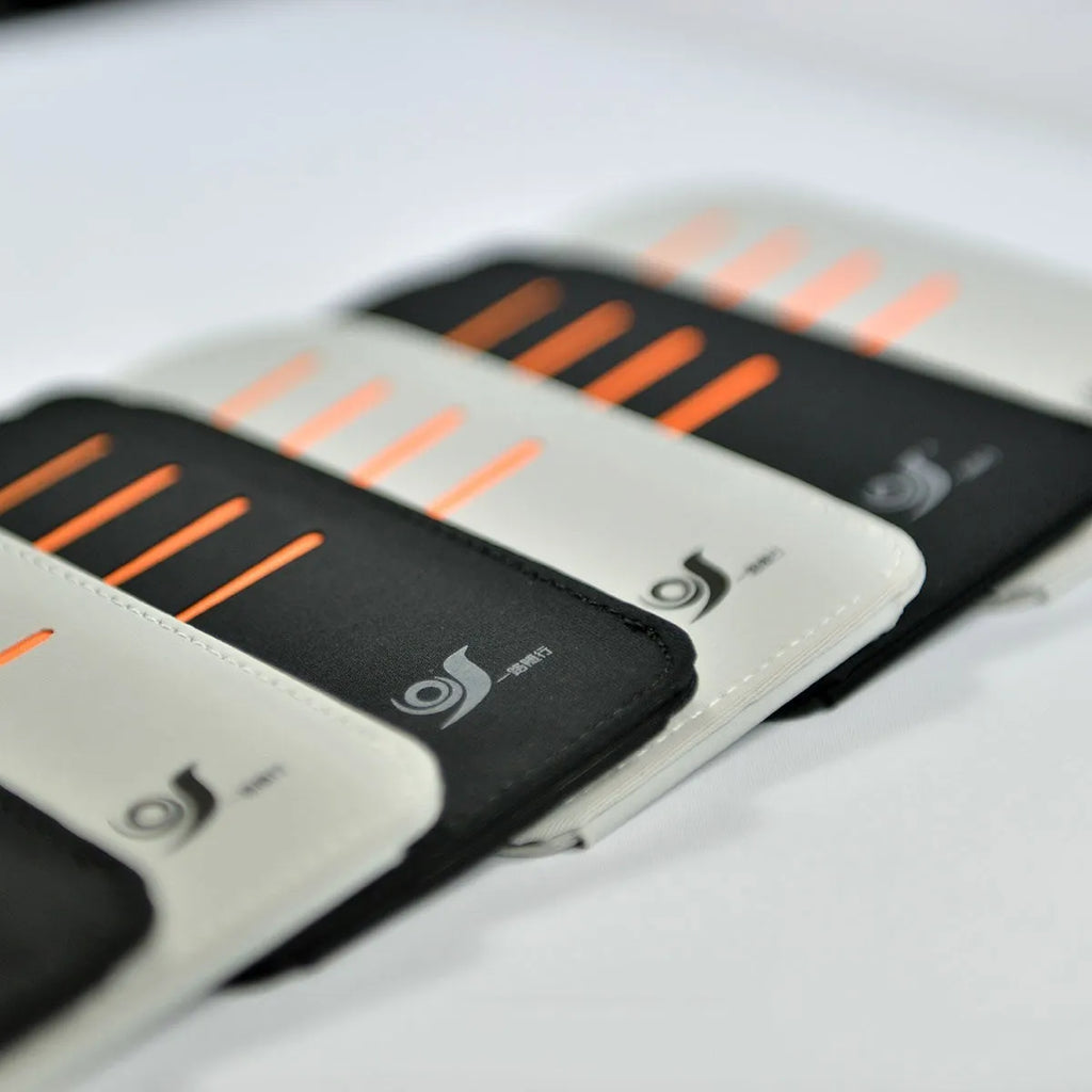 Car sun visor organiser shading panel in black or grey, holding sunglasses and cards.