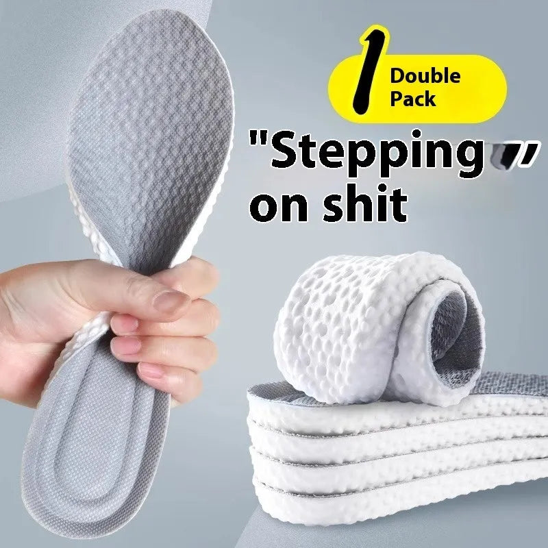 A pair of grey breathable sports insoles made of soft PU material, shown alongside scissors to illustrate the trimmable feature.