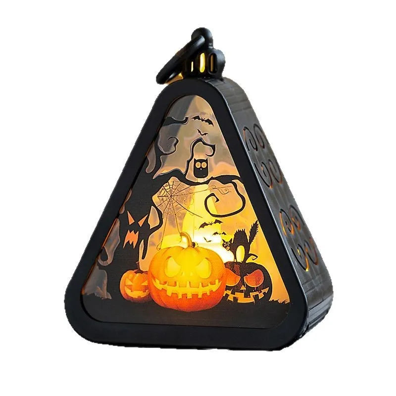 Small plastic Halloween pumpkin lamp and themed decoration props in four colour variants.