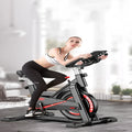 Black upright spinning bike with steel frame and console display for home cardio cycling