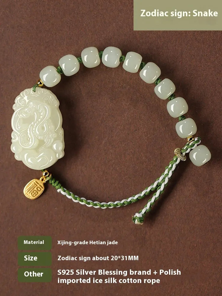 Red rope bracelet with a carved green Hetian jade Rabbit charm and a small S925 silver card on a cotton cord.