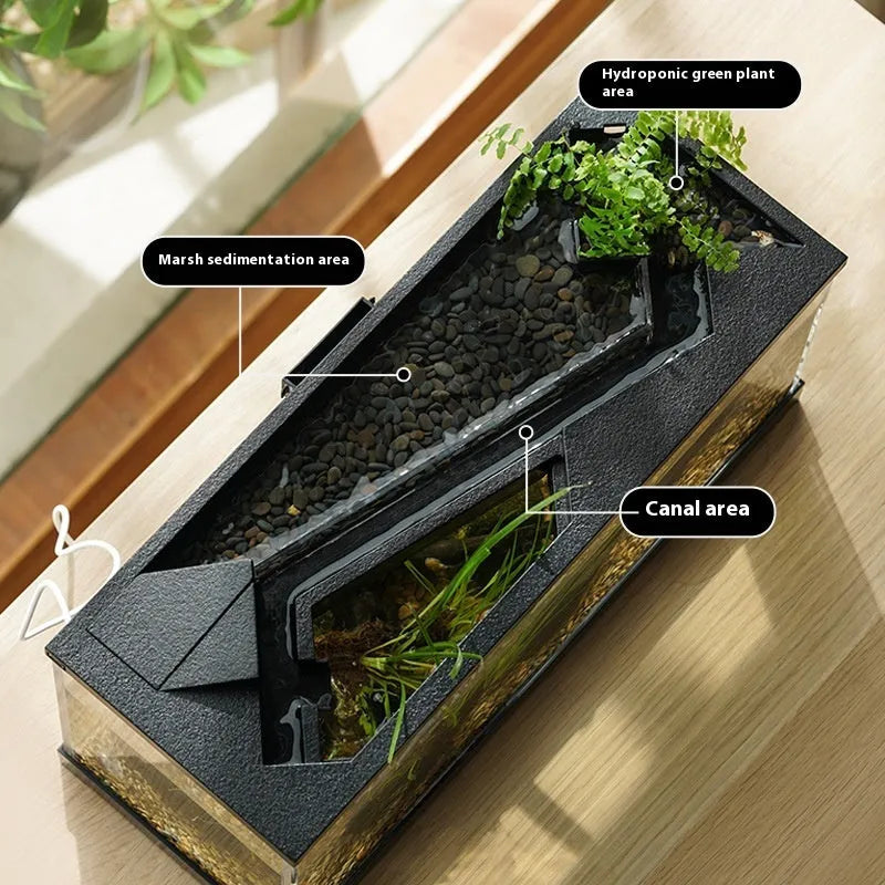 Small acrylic integrated lazy aquarium with circular filter, built-in lamp, external light, and heating mat for desktop use