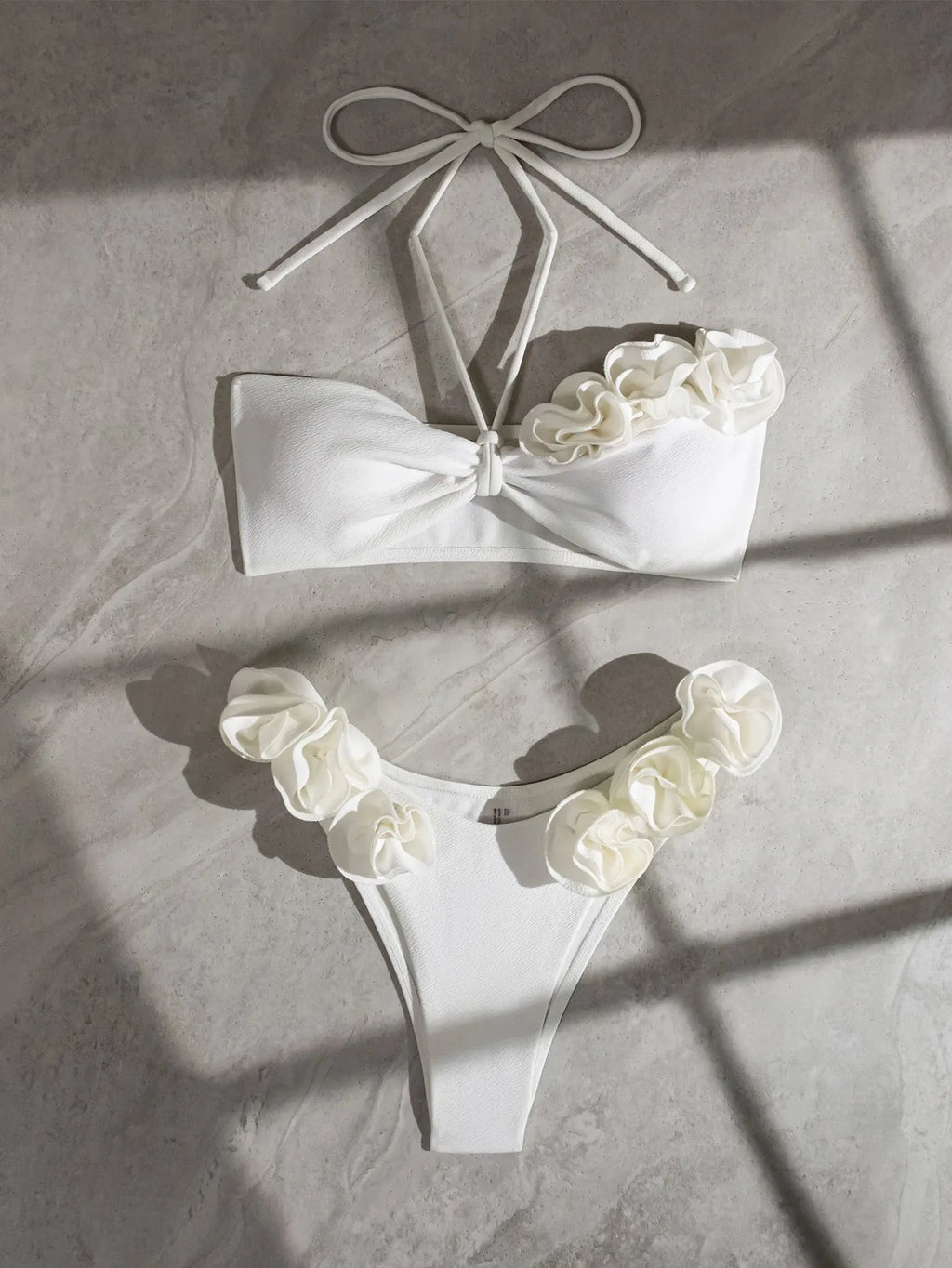 White halter neck lace-up swimsuit with three-dimensional floral pattern and split briefs style