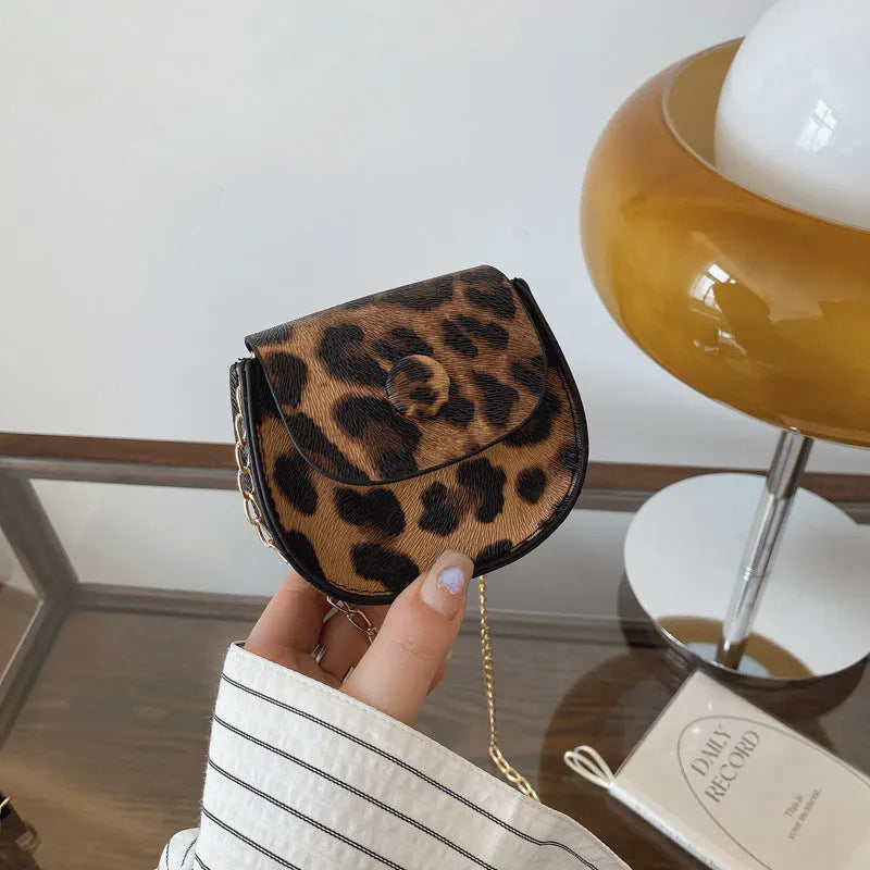 Leopard print mini crossbody saddle bag in PU, horizontal square shape with sandwich pocket, black and reddish brown