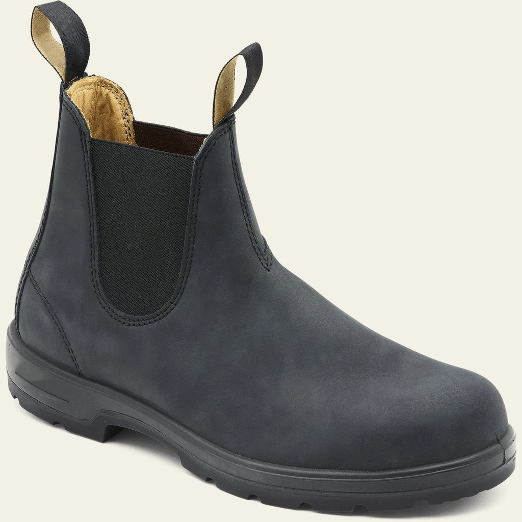 Vintage brown unisex Chelsea boots with frosted PU upper and car suture detailing on a wooden floor.
