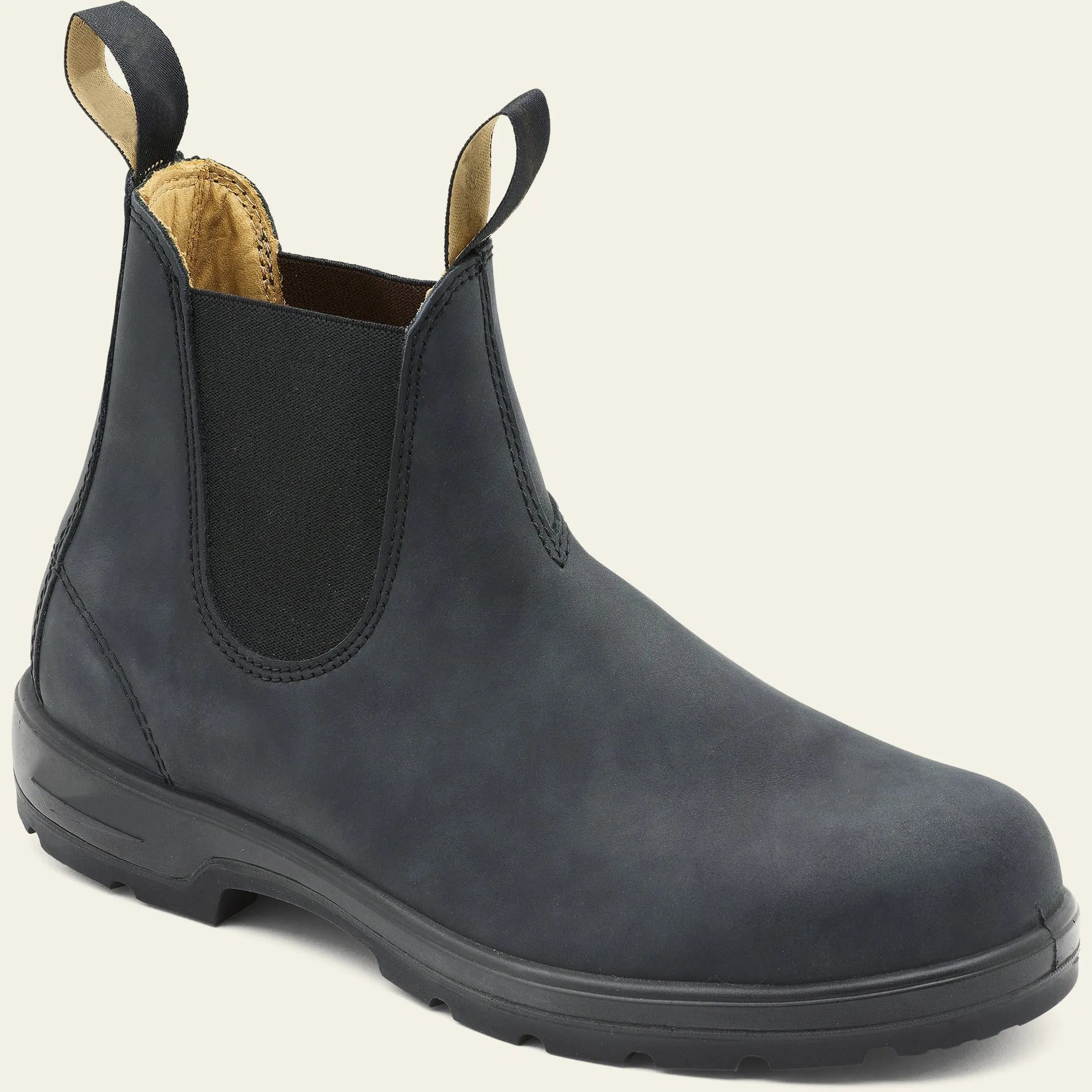 Vintage brown unisex Chelsea boots with frosted PU upper and car suture detailing on a wooden floor.