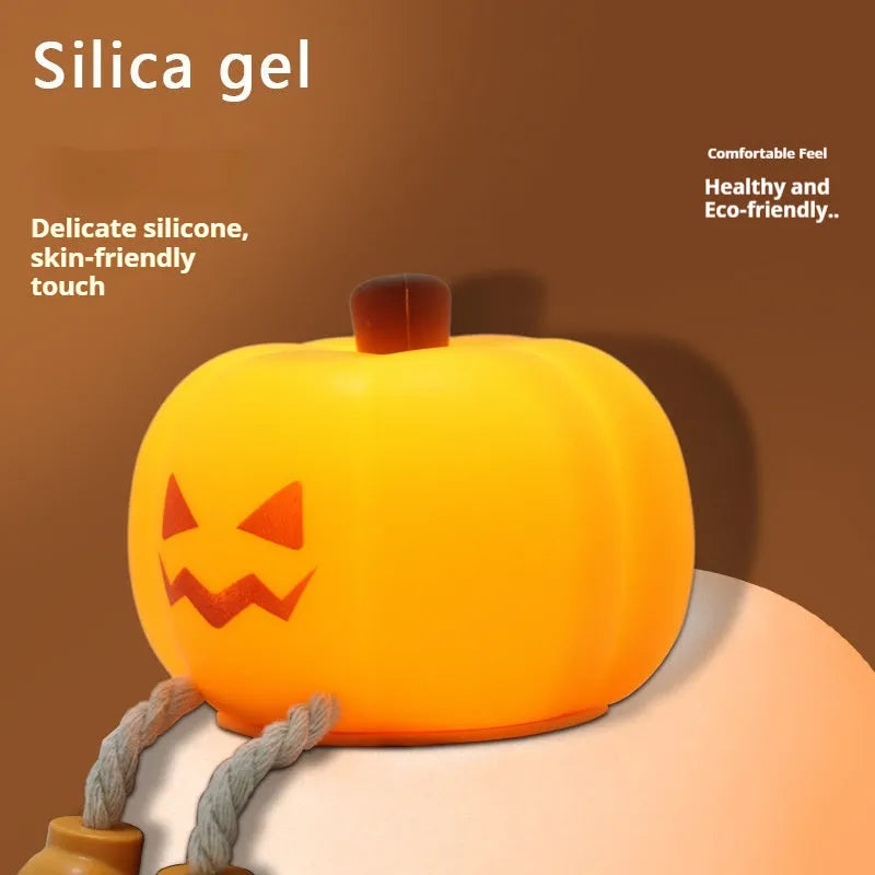 Soft silicone pumpkin night light with touch dimming controls and USB charging port