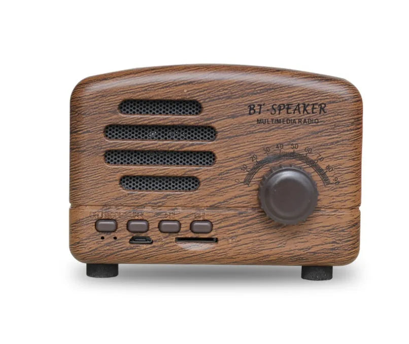 Compact vintage-style wood grain finish Bluetooth speaker on a wooden table.