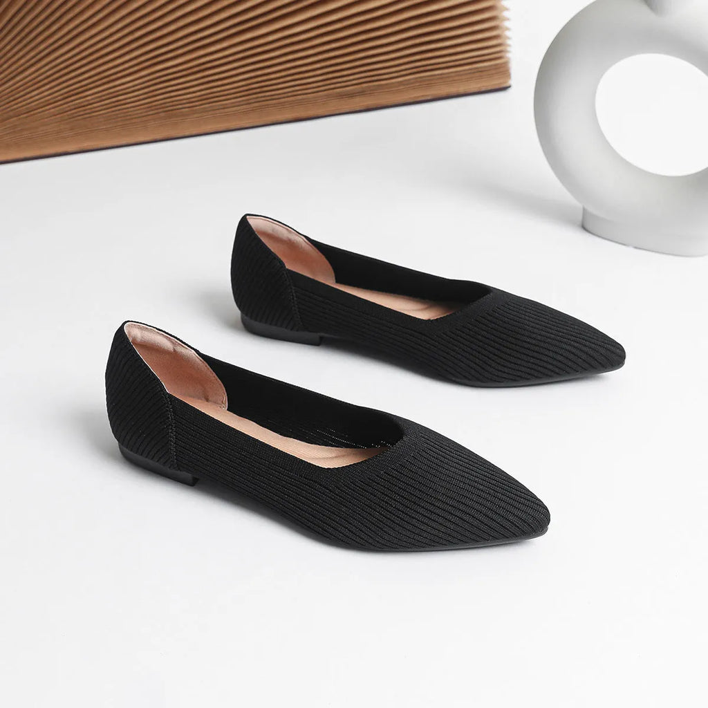 Women's apricot coloured knit flat pumps with a pointed toe and shallow mouth design on a plain background.