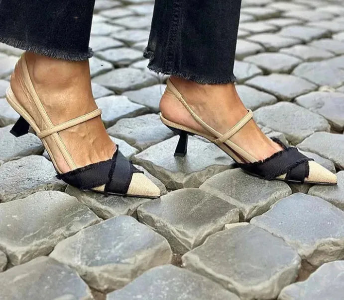 Women's apricot and black colour block stiletto sandals with pointed toe and buckle strap.