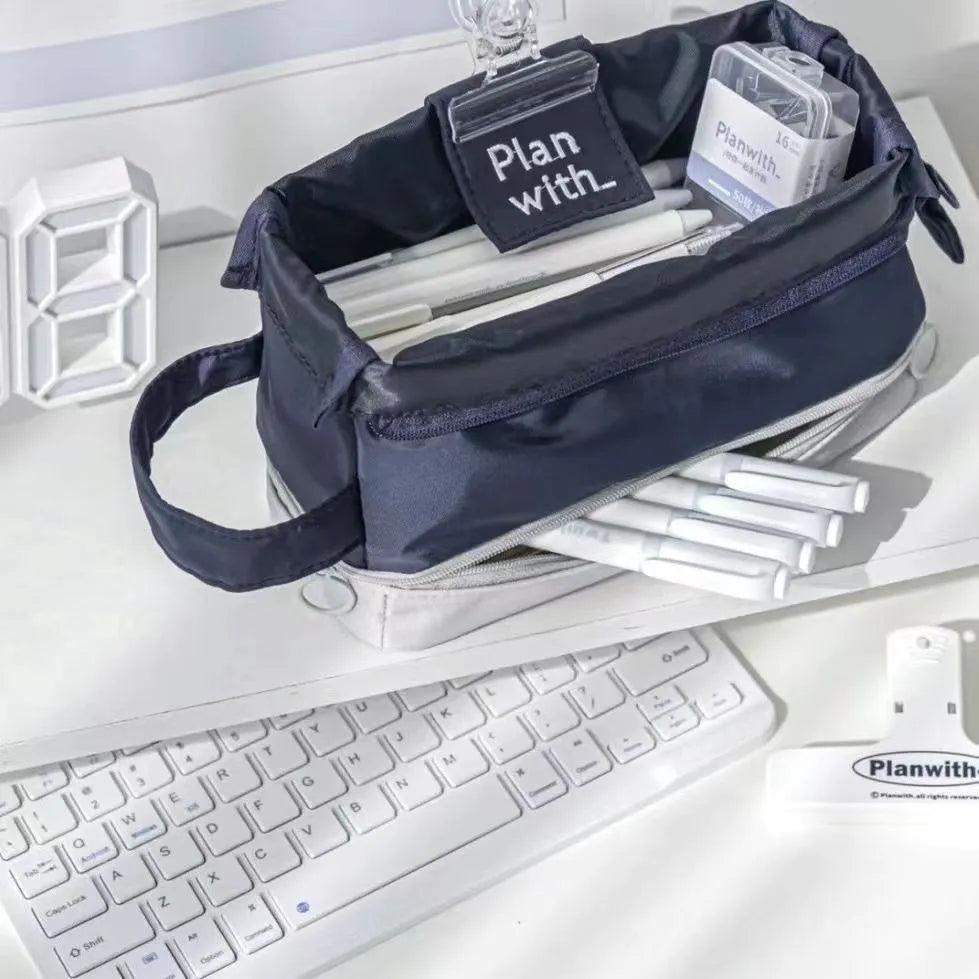 Double-layer folding pencil case in polyester fabric, shown in navy blue colour.