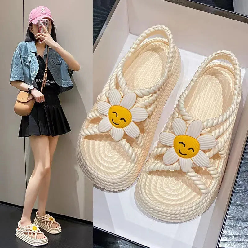 Women's PVC sandals with floral decorations and round toe design in beige colour
